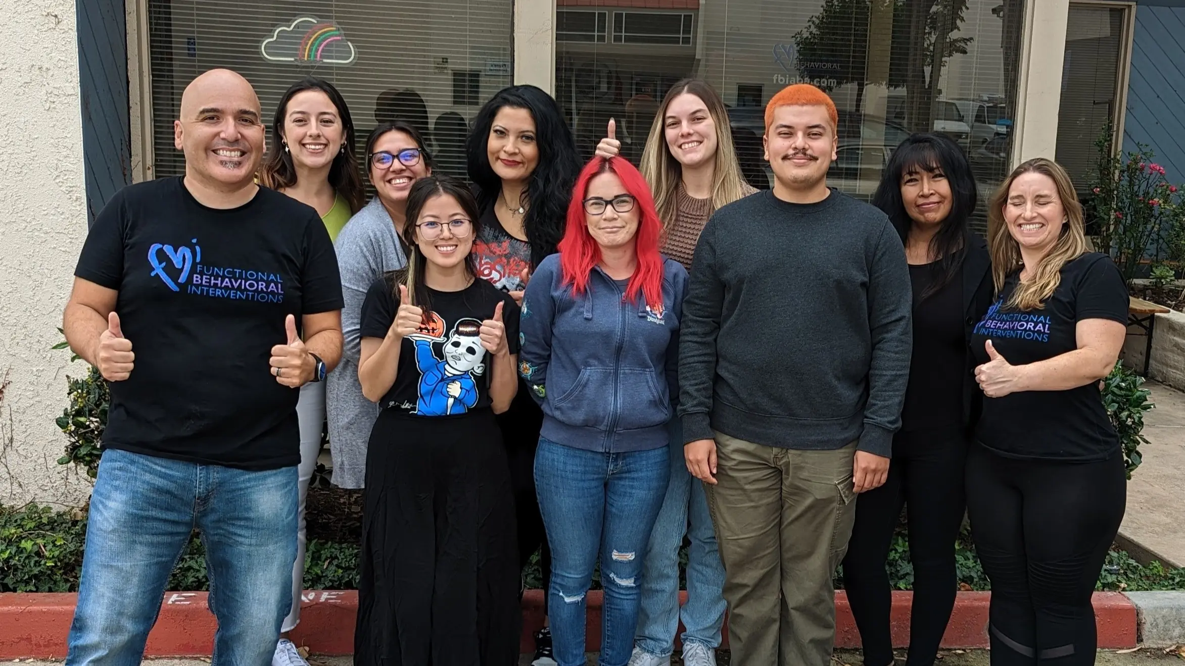 Staff photo in front of office